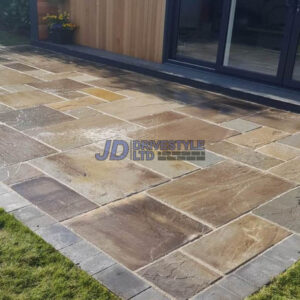 Indian Sandstone Patio with New Grass Lawn in Ashford, Kent