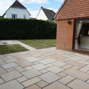 Indian Sandstone Patio with New Lawn in Ashford, Kent