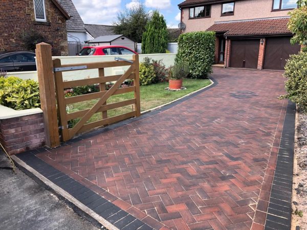 Brindle with charcoal border paving in Acrise Place