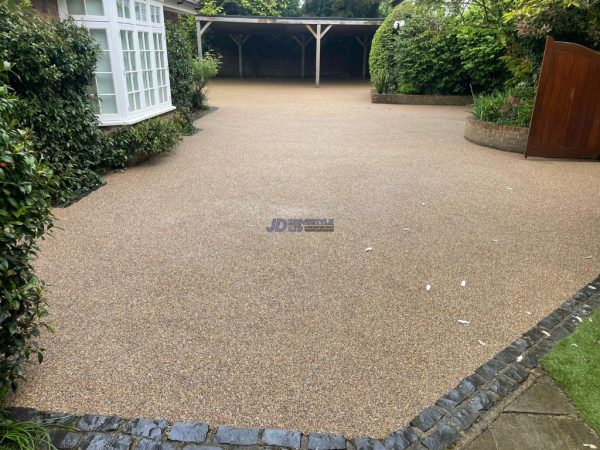 Golden chip resin on a driveway in Acrise