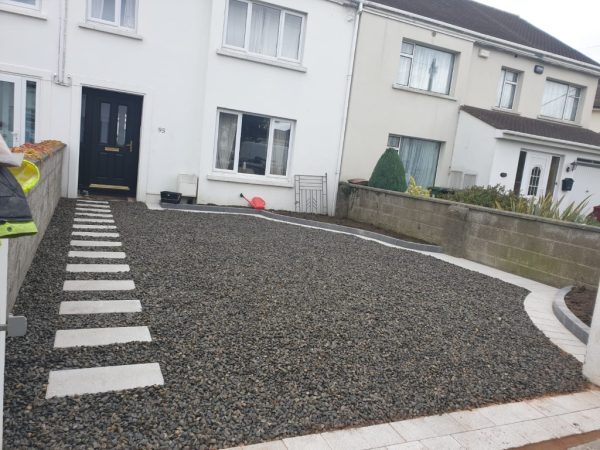 Gravel being laid on a driveway in Aldington