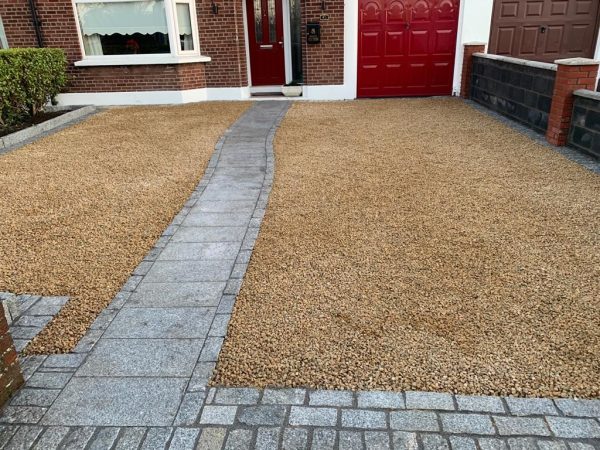 Gravel being laid on a driveway in Allington