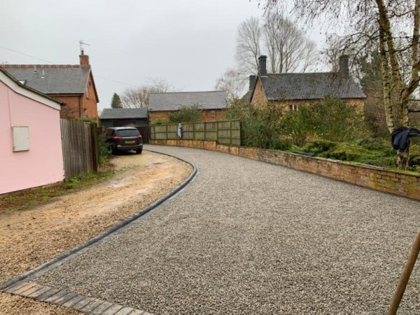 Gravel being laid on a driveway in Barming