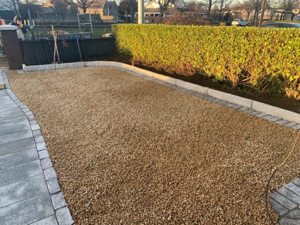 Gravel being laid on a driveway in Bedmonton