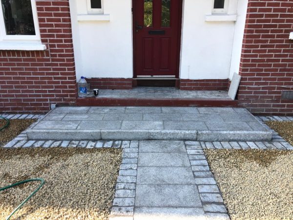 Gravel being laid on a driveway in Bromley Green