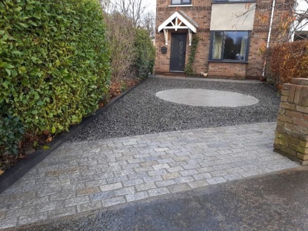 Gravel being laid on a driveway in Godinton