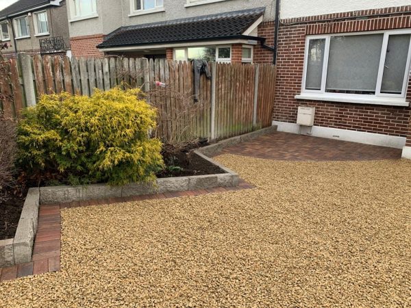 Gravel being laid on a driveway in Loose