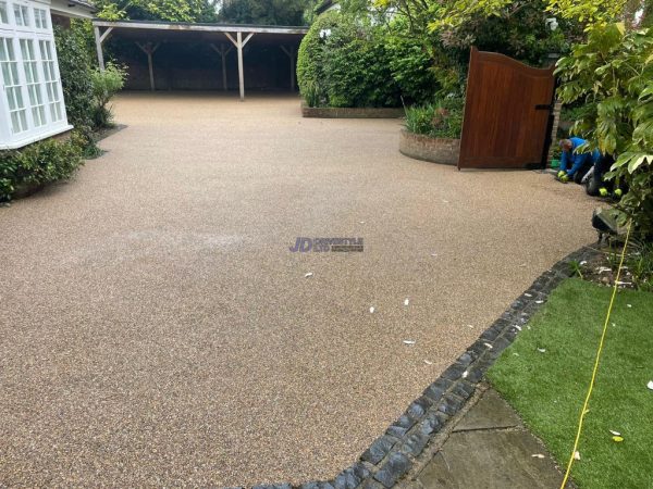 Resin with cobblestone border in Biddenden