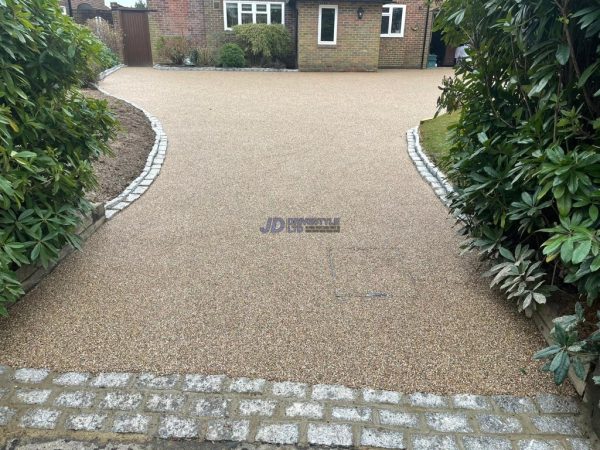 Resin driveway with cobblestones in Acrise, Kent