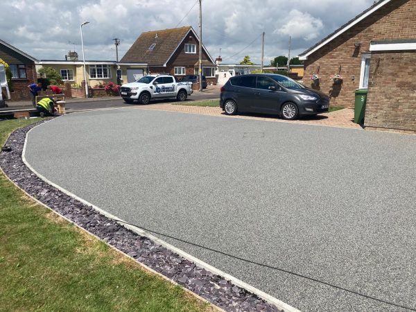 Silver resin driveway in Acrise