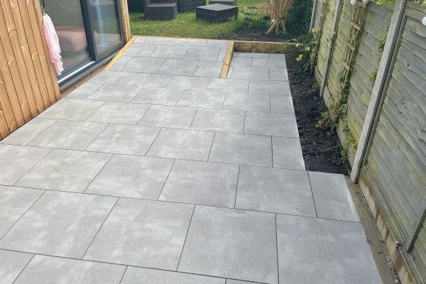 Smooth slabbed patio installation in Acrise