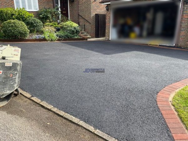 Tarmac with red brick border in Kit's Coty