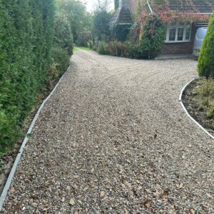 Gravelled Driveway with Kerbing and Porcelain Tiled Front Patio in…